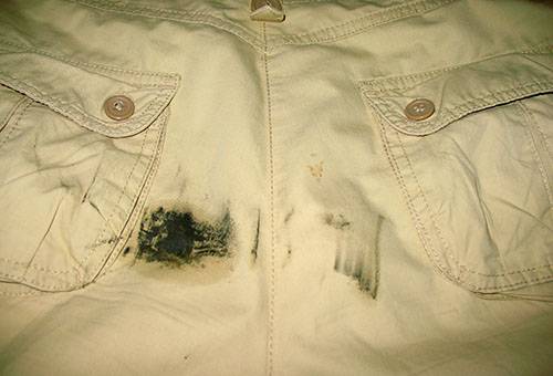 Fuel oil stain on cotton trousers