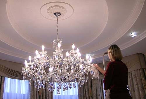 Cleaning a large crystal chandelier