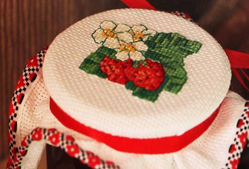 Canvas with cross stitch on a small hoop