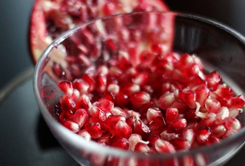 Pomegranate grains in a cup