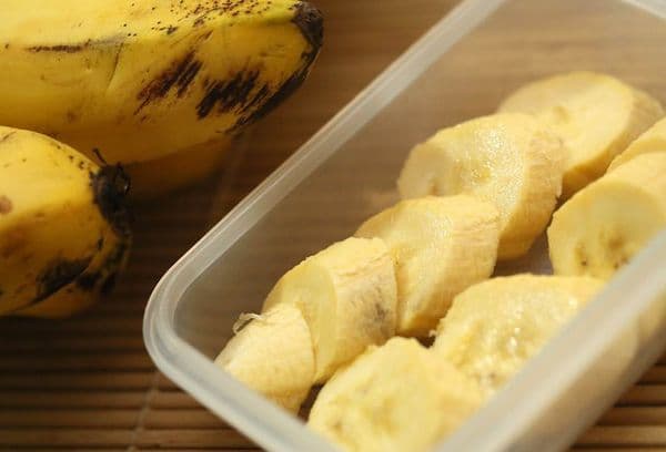 Peeled bananas in a container