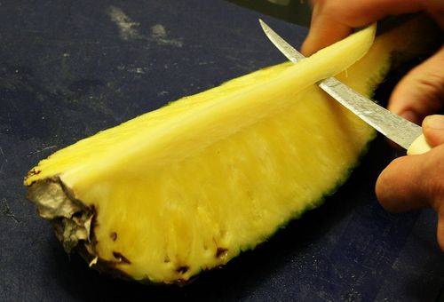 slicing pineapple - like a melon