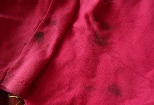 Aged hair dye stains on a t-shirt