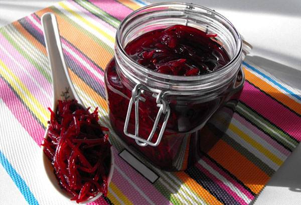 Grated beets in a glass jar