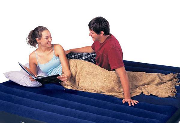 Guy and girl on an air mattress