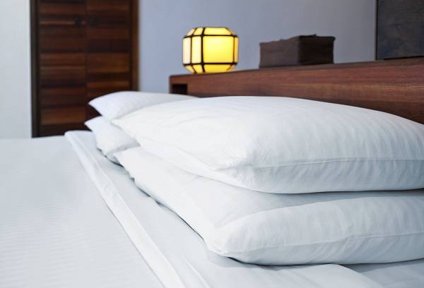 white pillows on the bed