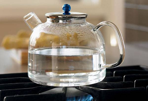 Glass teapot on the stove