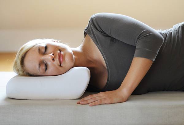 Girl sleeping on an orthopedic pillow