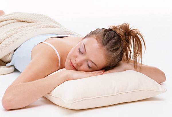 Girl sleeping on a bamboo pillow