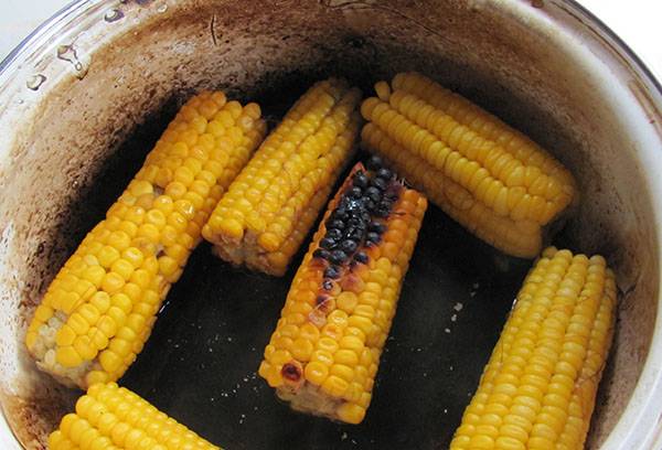 Burnt corn in an enamel pan