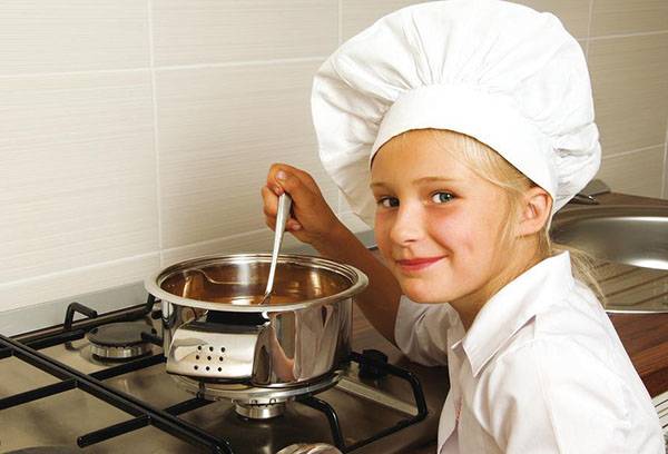 Girl preparing soup