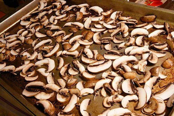 Mushrooms on a baking sheet for drying
