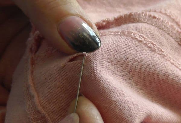 Sewing a hole with a needle