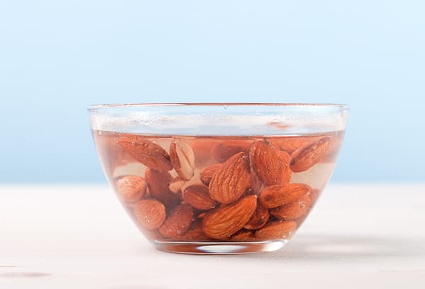 Almonds in a bowl of water