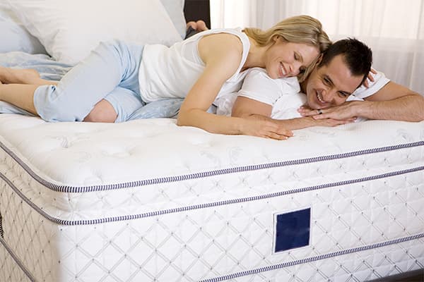 Couple on a new mattress
