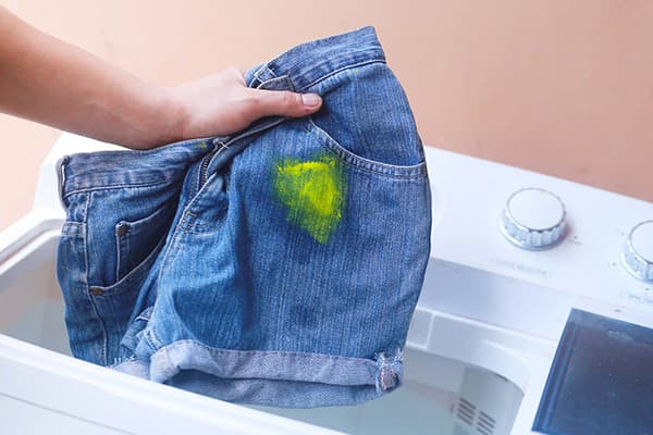 Wash shorts with a stain from the paint