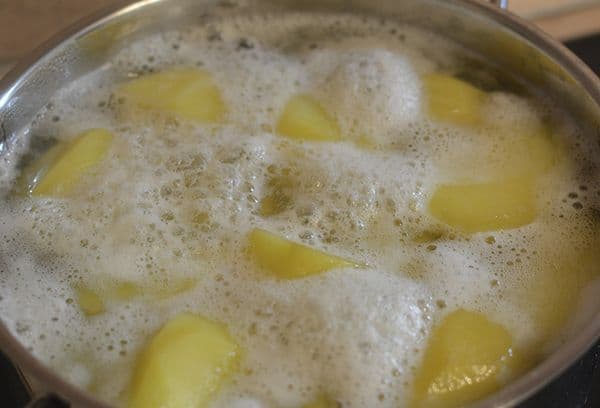 potatoes in water with foam
