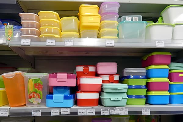 Shelves with plastic containers in the store.