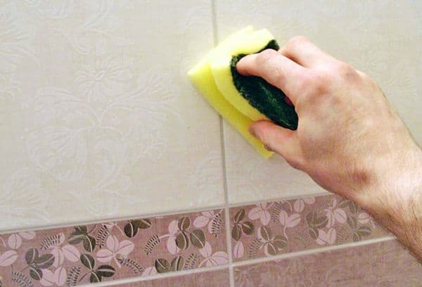 Tile washing with a sponge