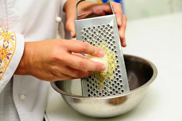Rubbing soap on a grater