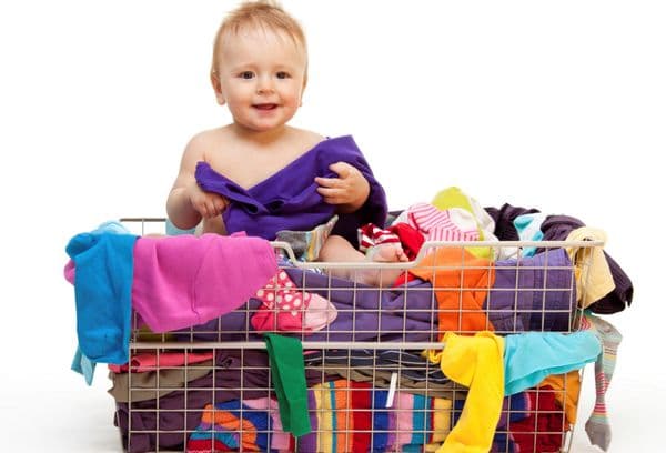 baby and basket with clothes
