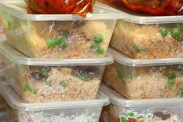 Frozen fish garnished in containers