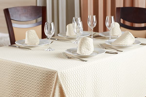 Served table with ironed tablecloth